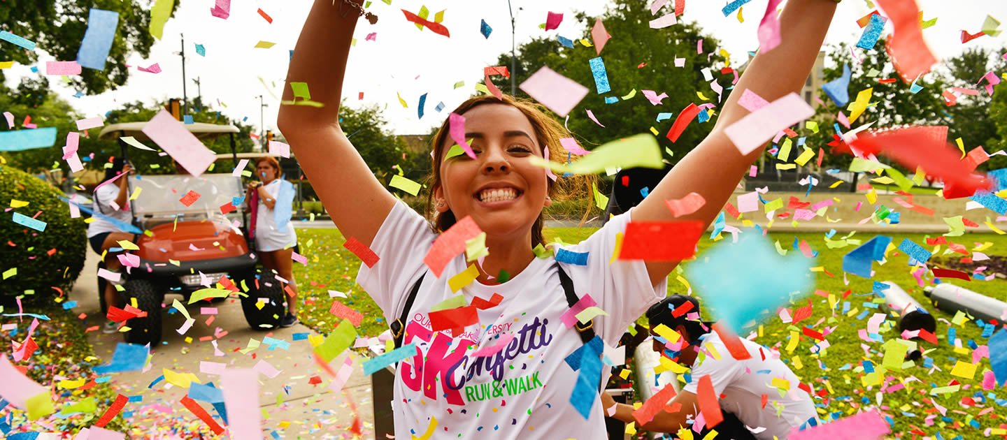 Female student with confetti falling